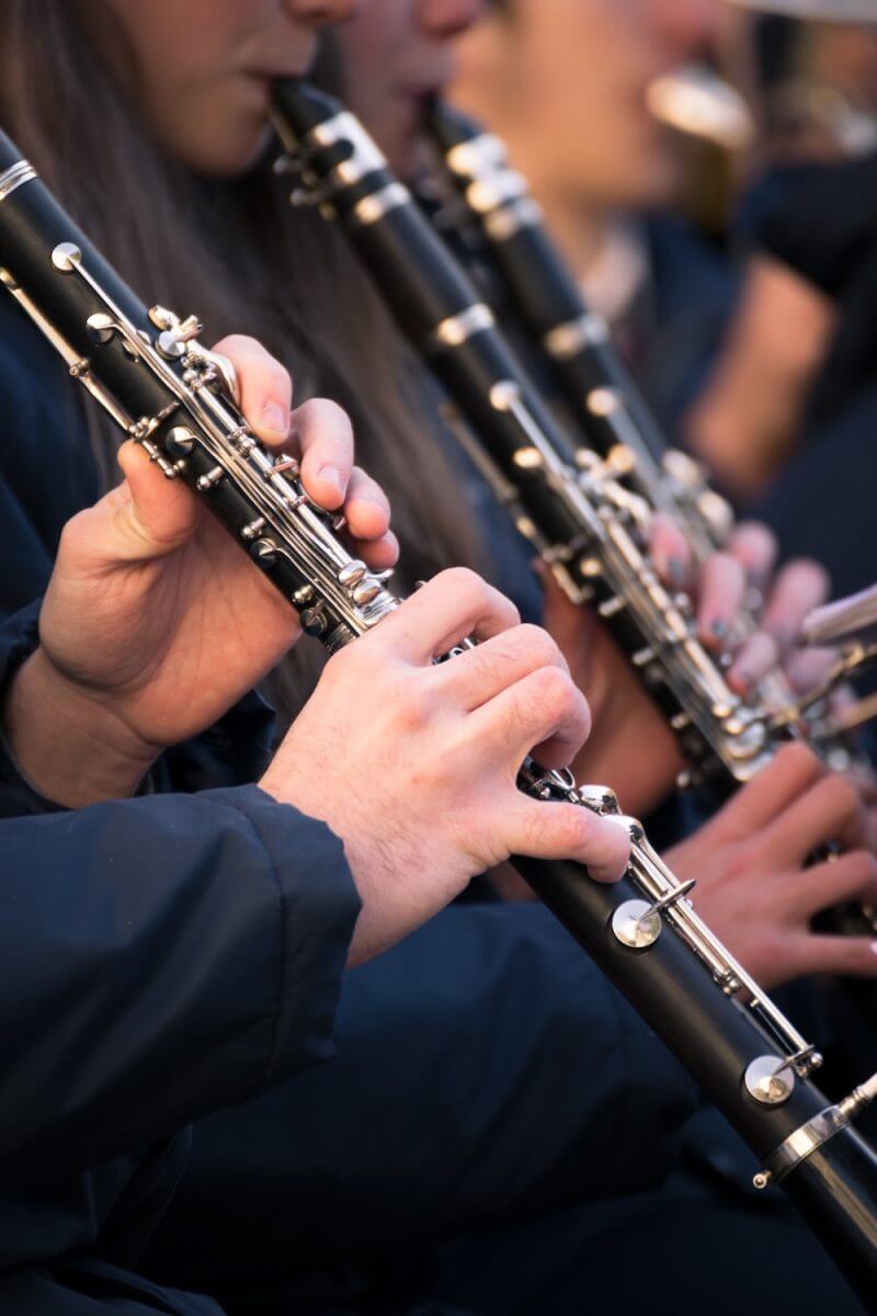 AdobeStock_133259400 group of clarinet players showing off their music education at a performance